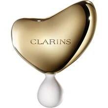 „Clarins“ brangusis auksinis veido masažo akmuo