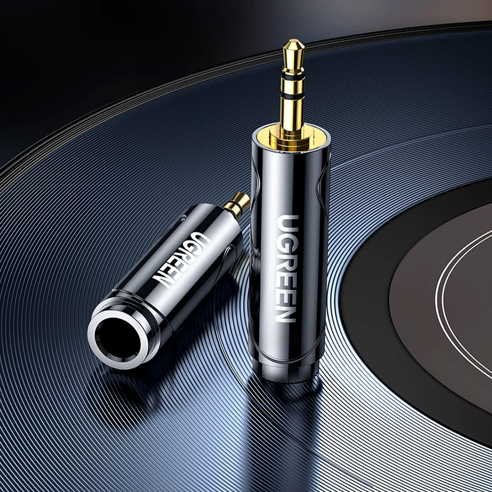 UGREEN adapteris / adapteris 3.5 mm-es lizdas-ről 6.5 / 6.35 mm-es mini jack-re (szürke)